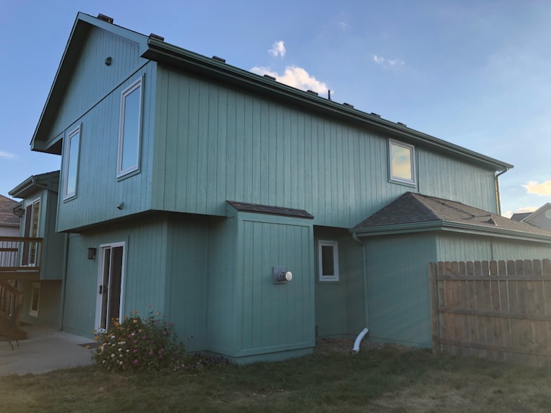 The rear elevation after repainting in green with white trim